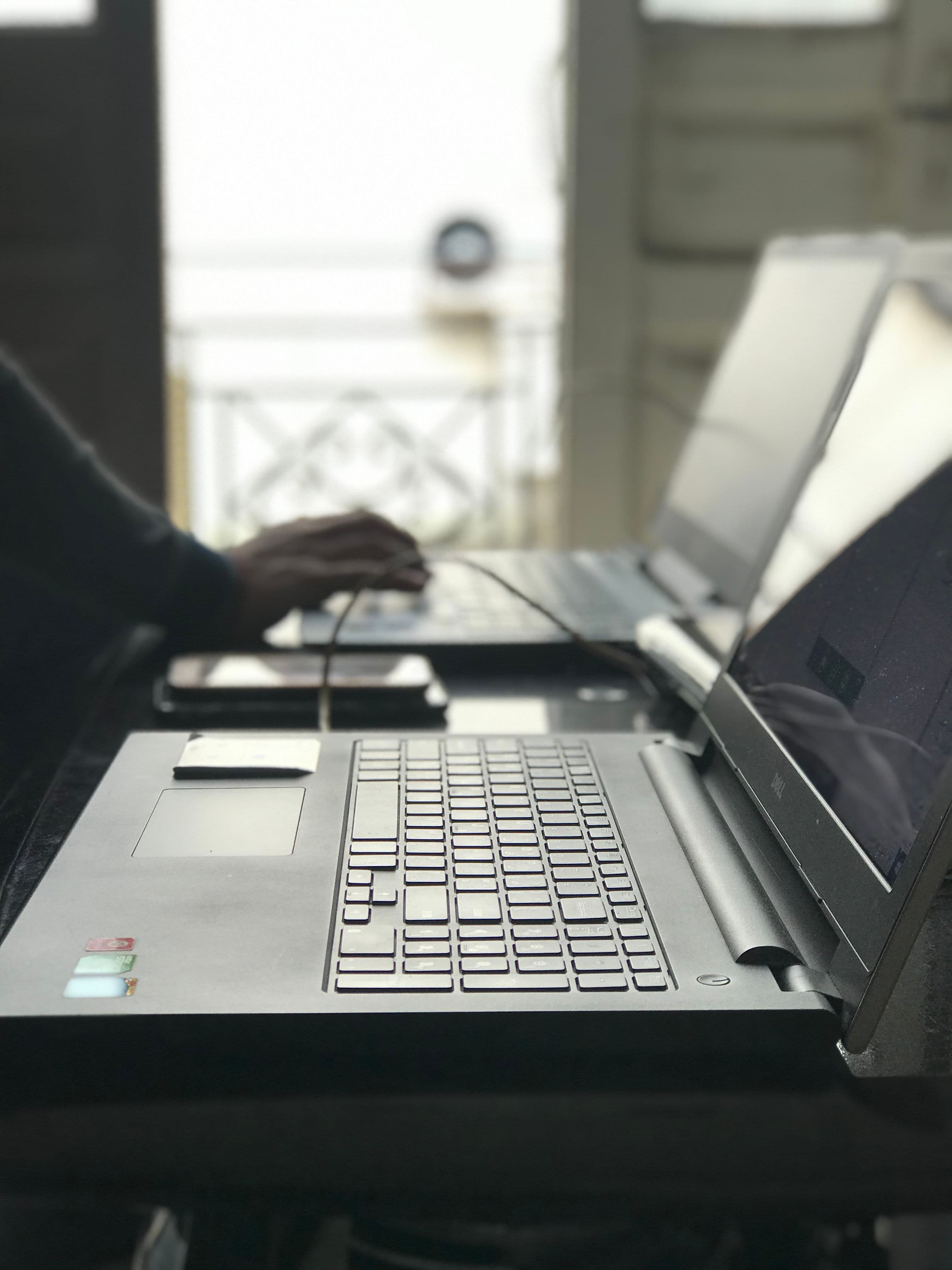 Professional workspace with laptops used to demonstrate the introducer portal