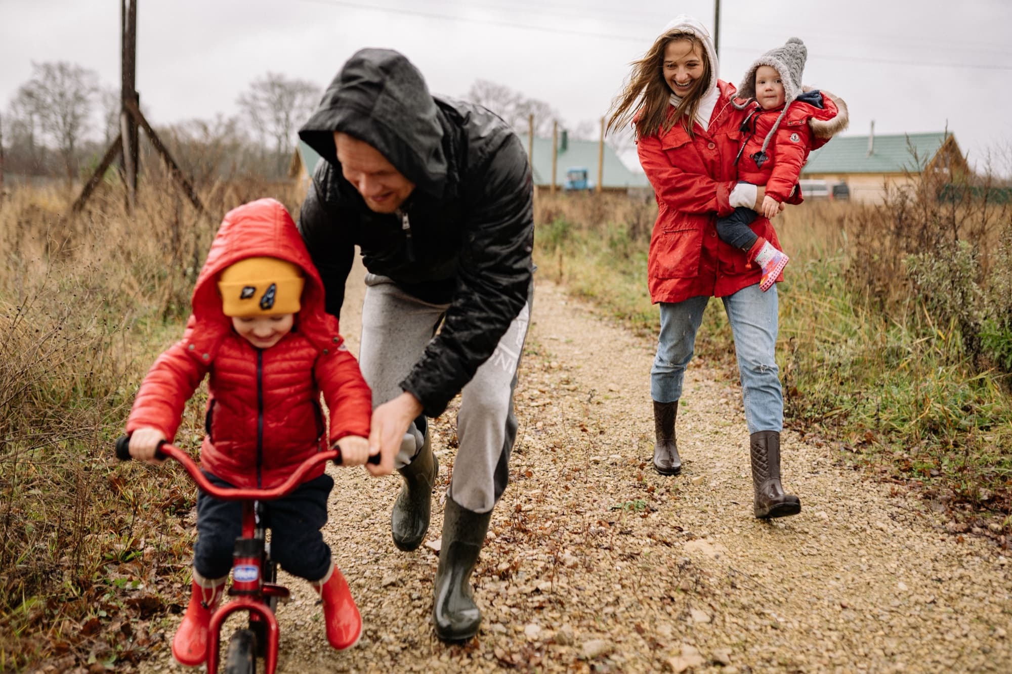 A family walking together on a rainy day